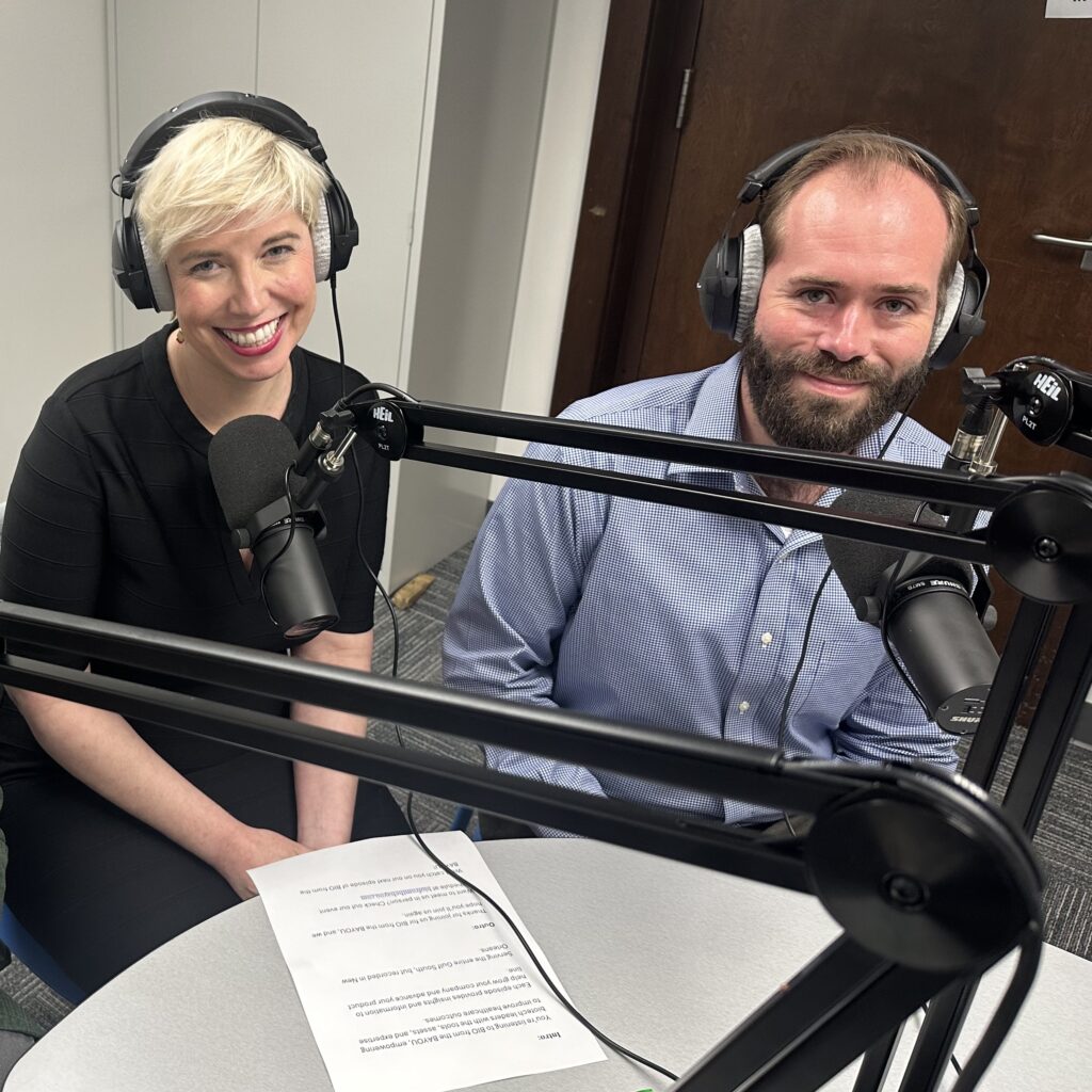 Elaine Hamm on the left, Alexis Ducote on the right, sitting side by side with headphones on and microphones in front.