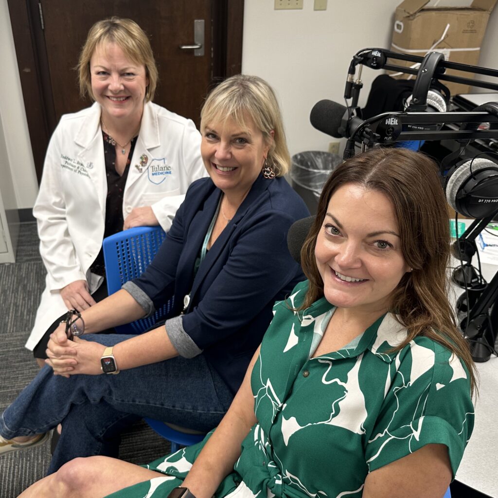 From left to right, Heddwen Brooks, Sharon Courtney, and Ellen Palmintier sitting on chairs at the recording table.