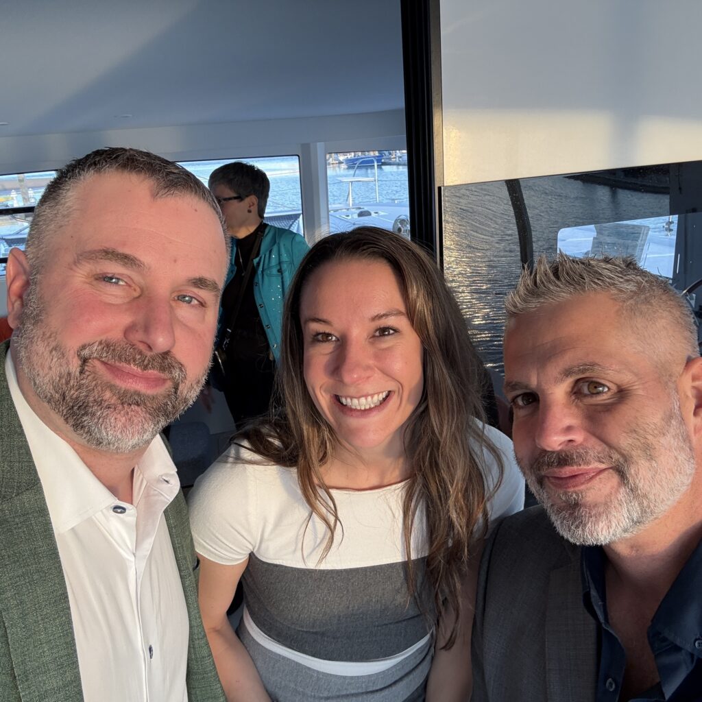 James Zanewicz with two others at a conference