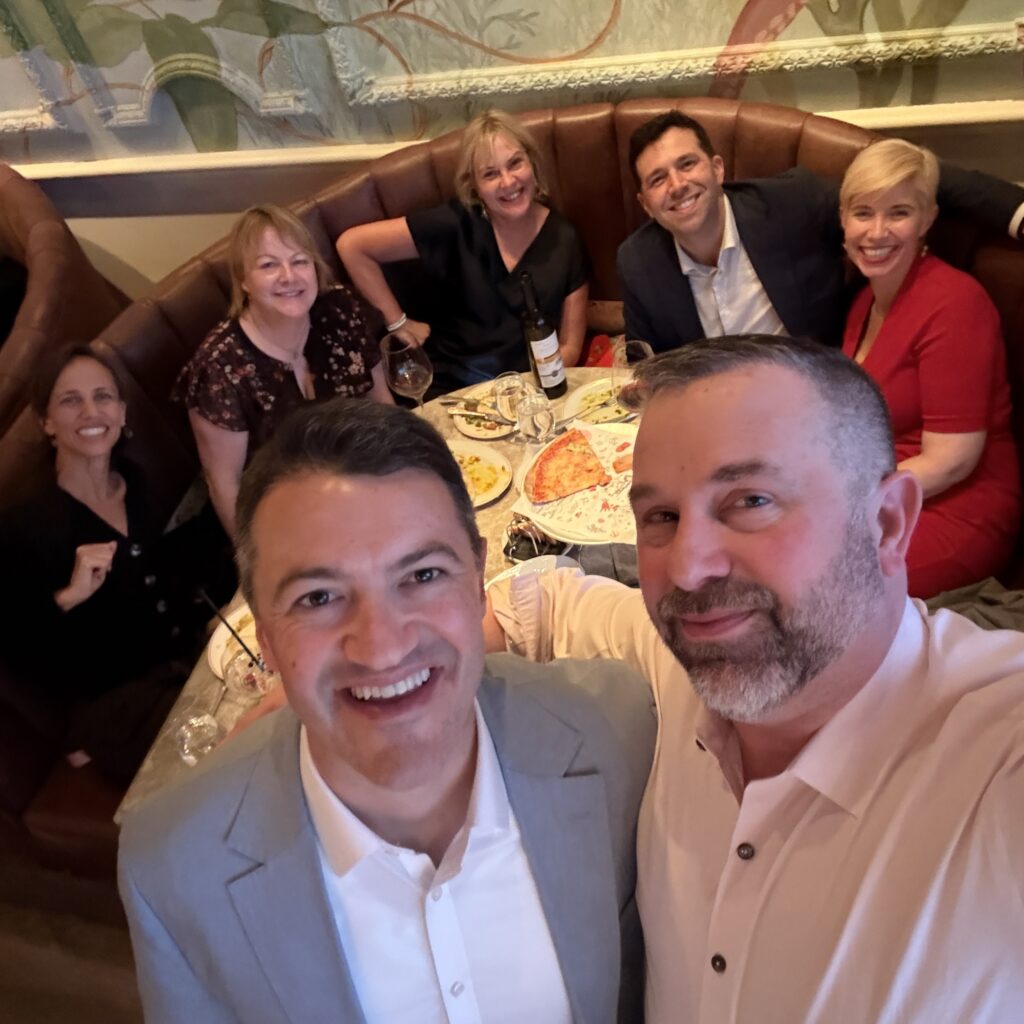 James Zanewicz with a group of colleagues at dinner