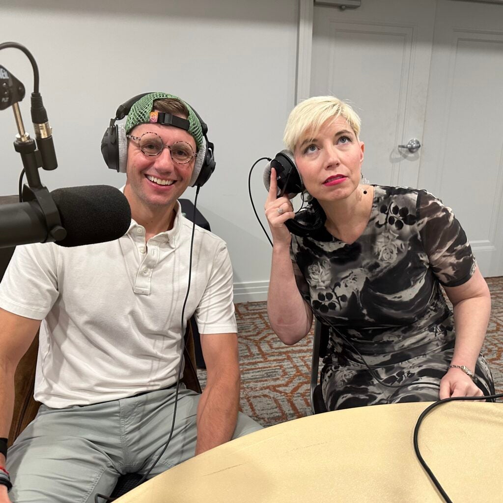Cain McClary and Elaine Hamm wearing headphones