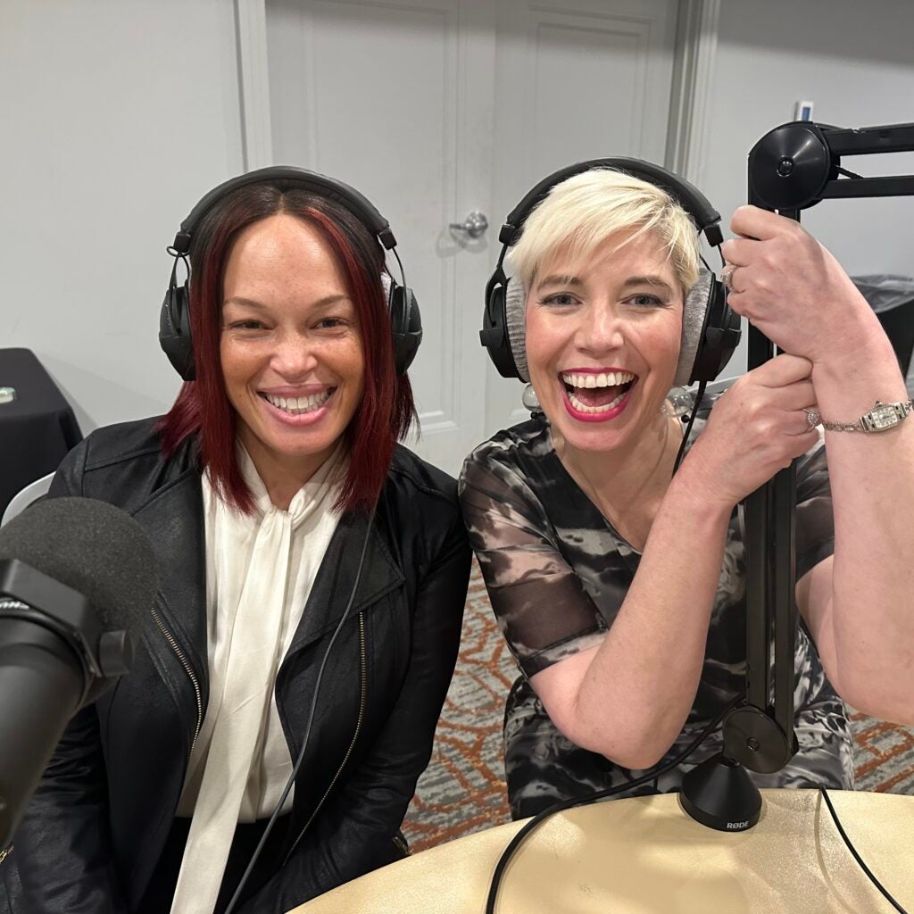 Renee Williams and Elaine Ham with headphones on